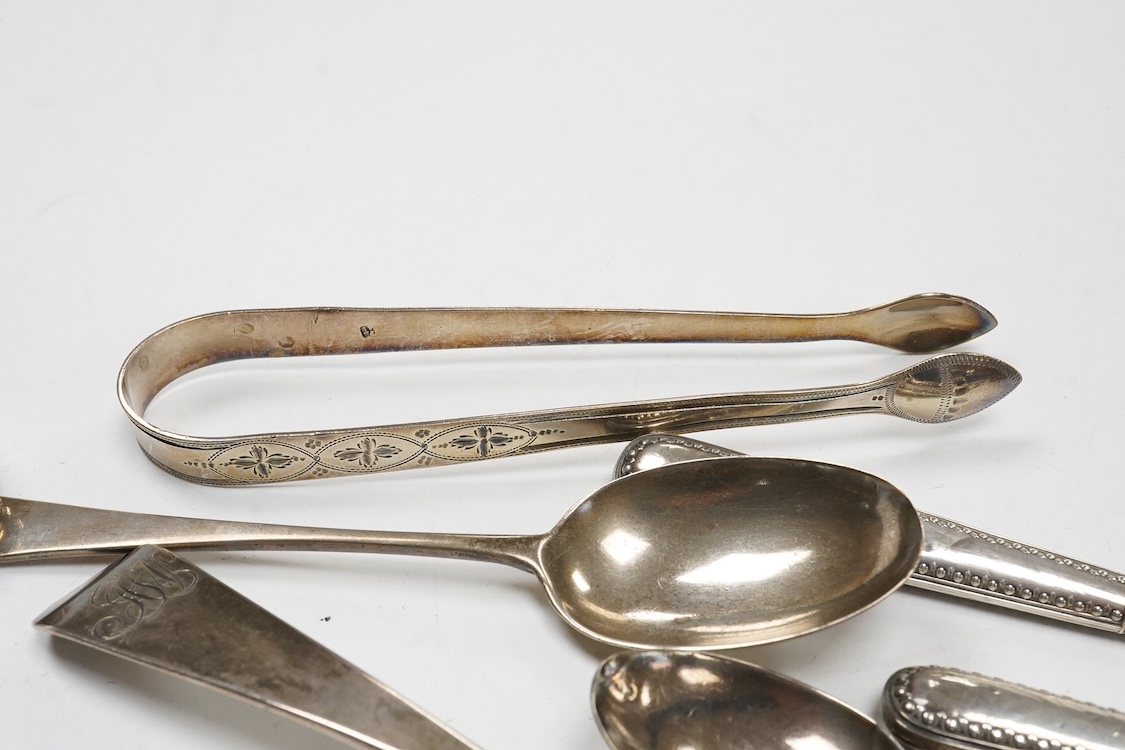 A collection of small silver and white metal items, including an Indian Hamilton & Co small dish, the centre inset with 1840 one rupee coin, one other white metal dish, two modern silver mounted napkin rings, fourteen as